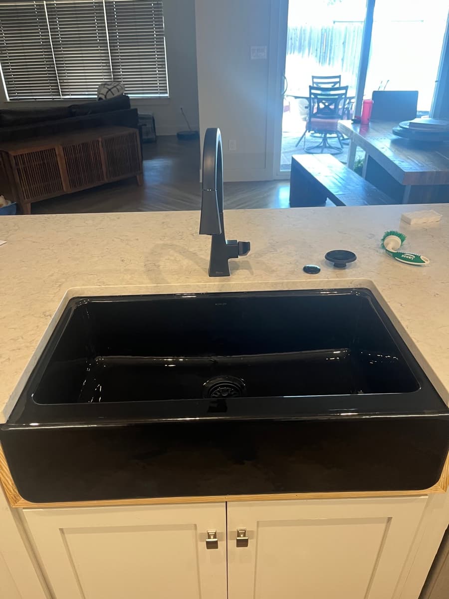 Matte black kitchen faucet and sink after installation