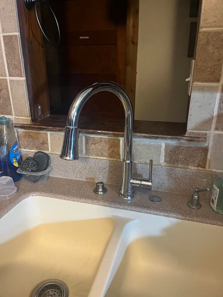 Active plumbing worksite with excavation equipment